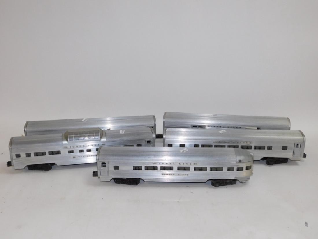 FIVE LIONEL LINES TRAIN CARS, O GUAGE.: APPROX 15" LONG, 3 1/2" TALL. GOOD CONDITION. INCLUDES, LIONEL LINES #2531 SILVER DAWN OBSERVATION CAR, #2530 SILVER EXPRESS AGENCY BAGGAGE CAR, #2532 SILVER RANGE, DOME CAR, #2534 SILVER BLUFF