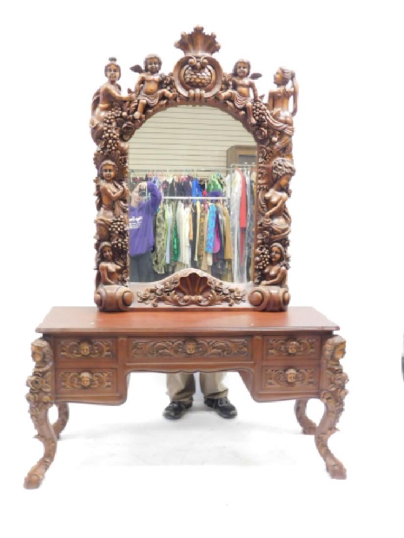 HEAVILY CARVED VANITY WITH MIRROR AND BENCH: UPHOLSTERY ON BENCH IS GOOD. VERY HEAVILY CARVED WITH CHERUBS, VINES, AND GRAPES. 81" TALL, 54" LONG, 19" DEEP