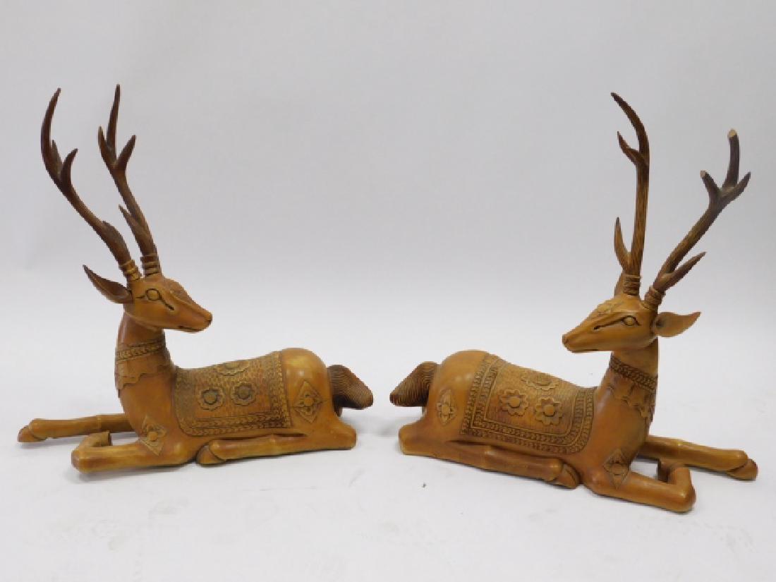 PAIR OF CARVED DEER: ONE DEER HAS CHIPPED ANTLERS