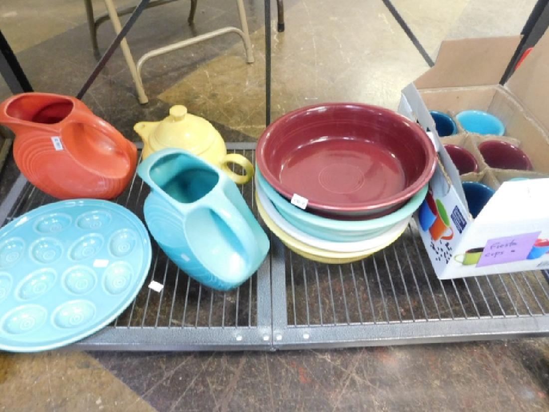 COLLECTION OF FIESTA WARE: PITCHER, TEA POTS, BOWLS, CUPS.