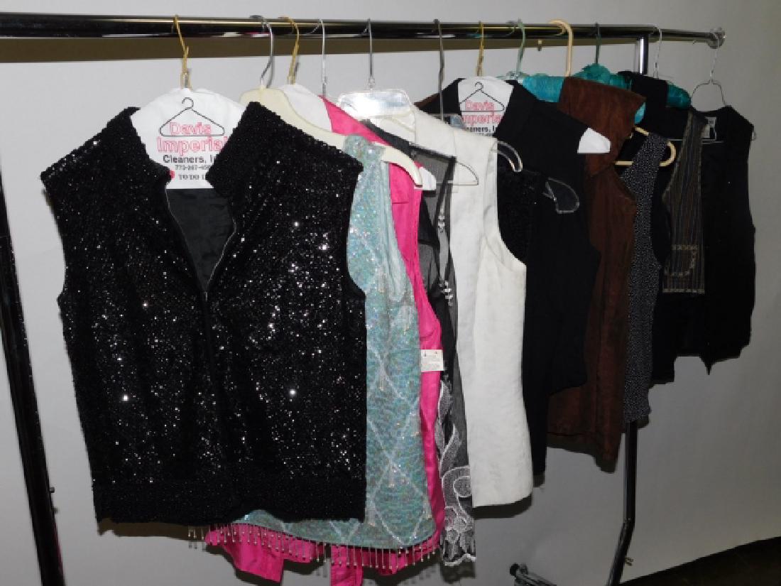 COLLECTION OF BEADED AND SEQUIN WOMAN'S CLOTHES: BLOUSES, VESTS, AND MORE SIZES SMALL TO LARGEPLEASE NOTE: ALL CLOTHING IS SOLD AS IS. WE DO INSPECT EACH PIECE HOEEVER IT IS POSSIBLE THAT WE MAY MISS SOMETHING, MORE INFORMATION CAN BE UPON REQUEST.