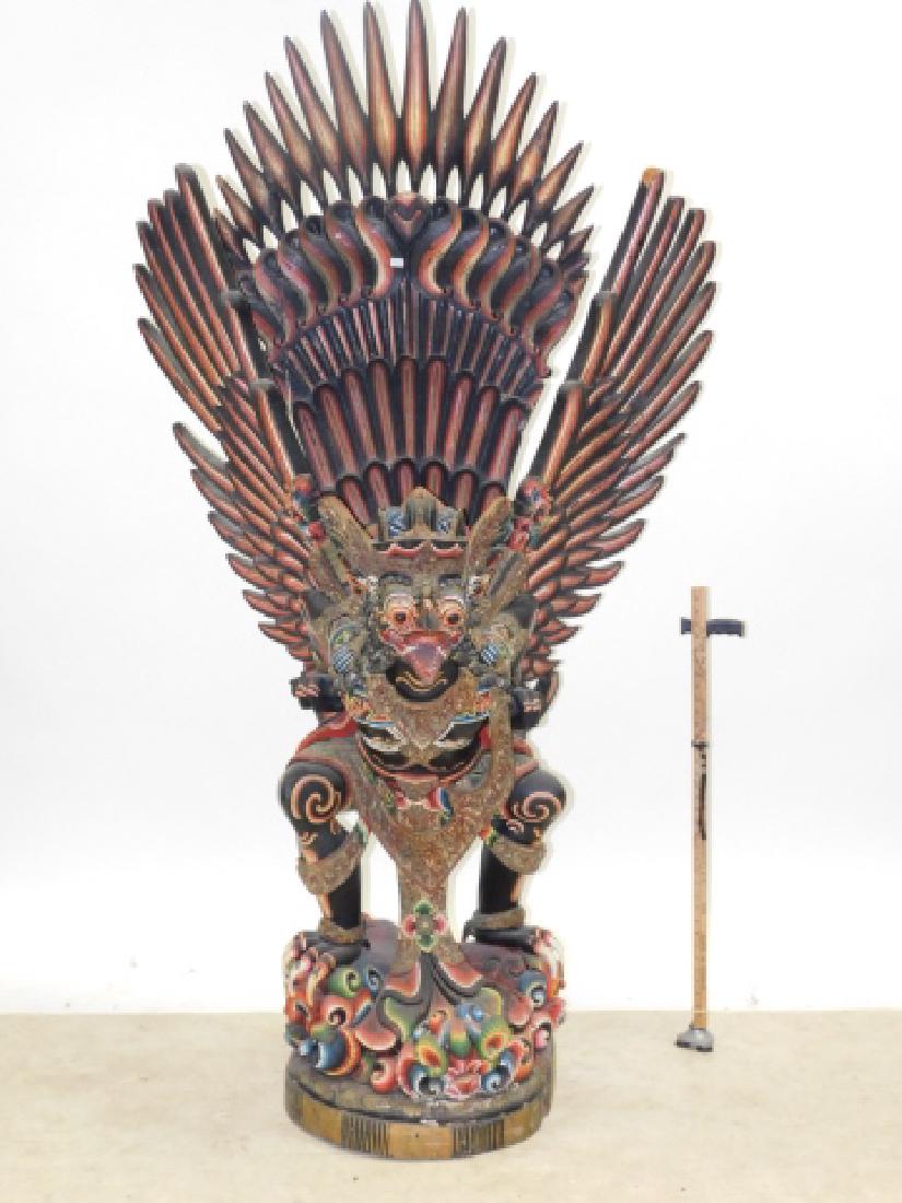 INDONESIAN WOOD CARVED DRAGON: CHIPPED WINGS AND NOSE. MISSING TALONS. 7 1/2 FEET TALL. WINGS ARE REMOVABLE.