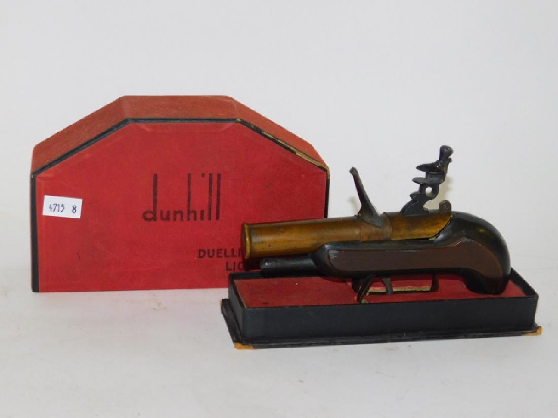 DUNHILL DUALING PISTOL LIGHTER: 6 1/2" LONG. MINOR DING ON SIDE, OTHERWISE GOOD CONDITION. WITH ORIGINAL BOX.