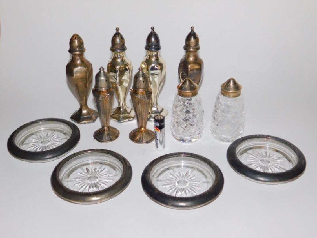 COLLECTION OF SILVER PLATE.: VARIOUS SIZES OF SALT AND PEPPER SHAKERS ALONG WITH COASTERS.