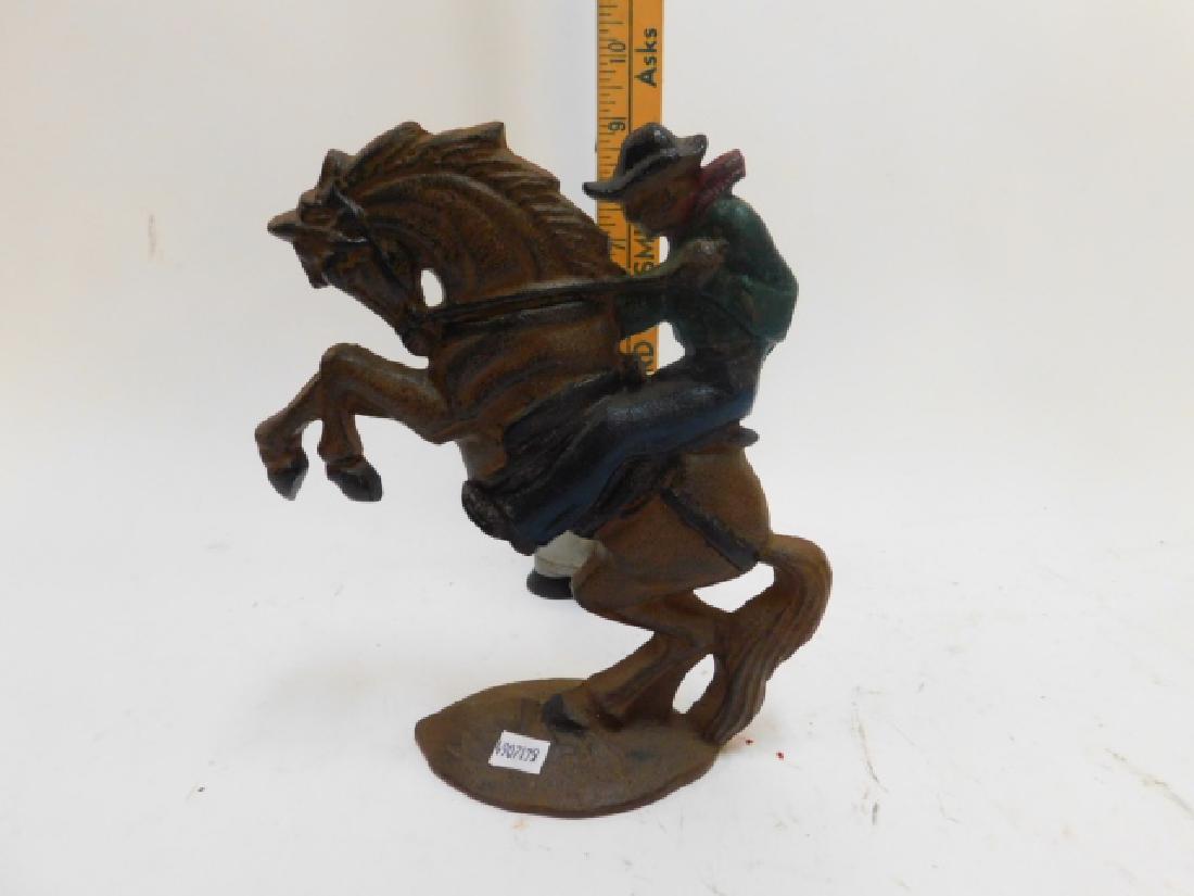MODERN, CAST IRON COWBOY DOOR STOP: MODERN.