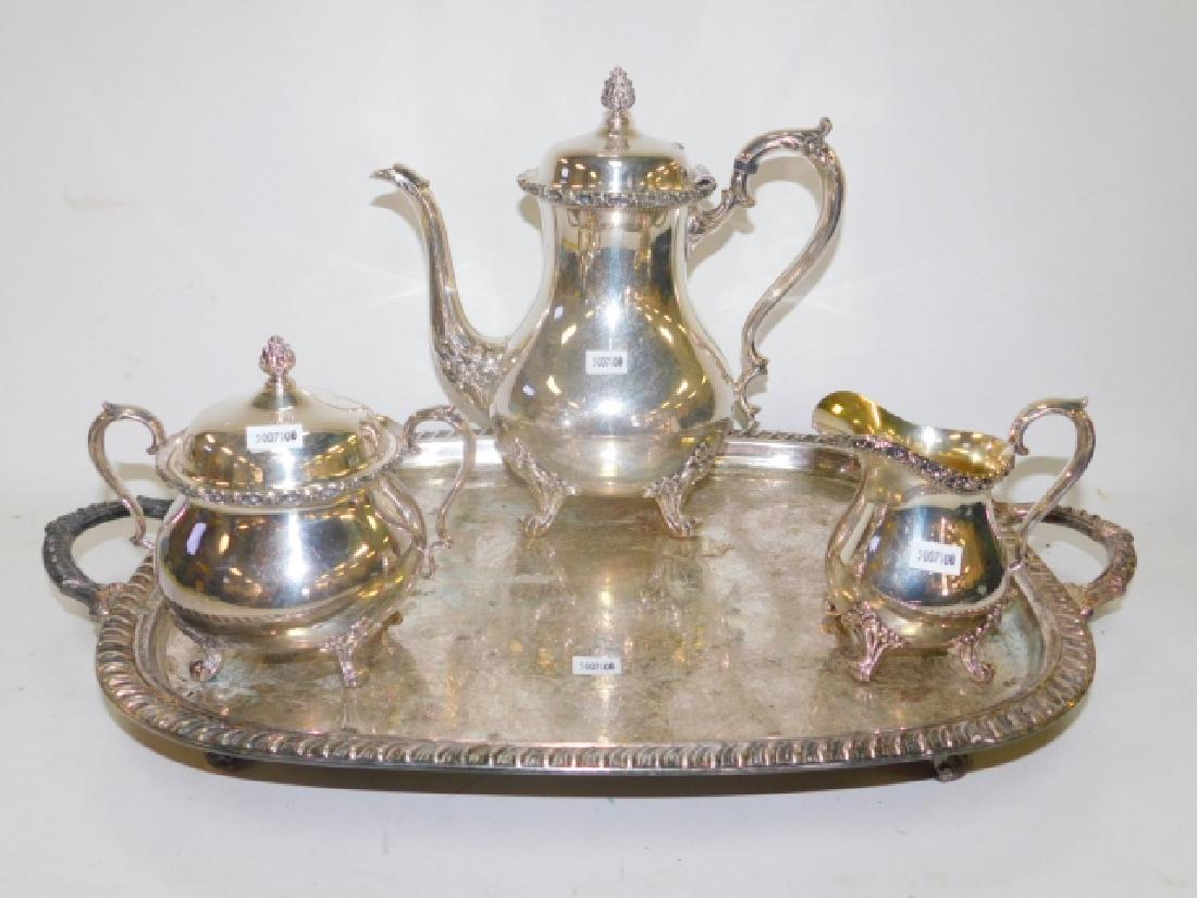 SILVER PLATE TEA SET WITH TRAY: GOOD CONDITION. TEA POT IS 9 1/2" TALL. TRAY IS 17 1/2" LONG WITHOUT HANDLES.