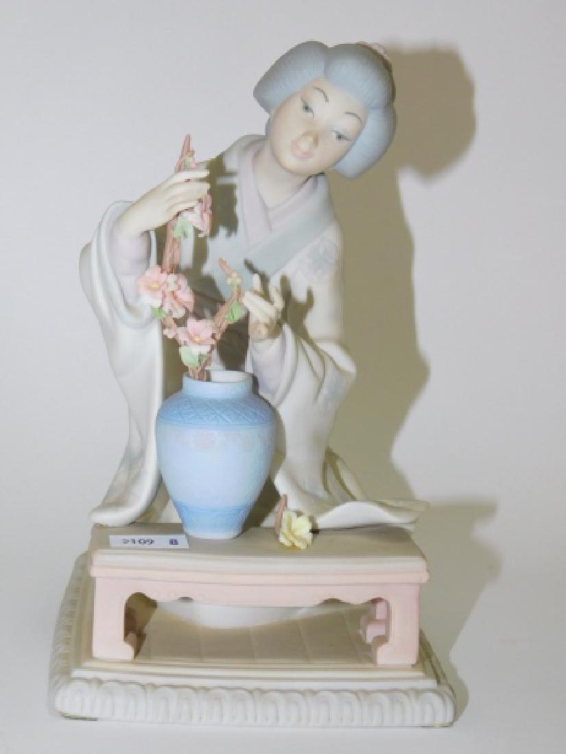 LLADRO, JAPANESE WOMAN WITH FLOWERS: NO BOX. MATTE FINISH. APPROX 7 1/2" TALL.