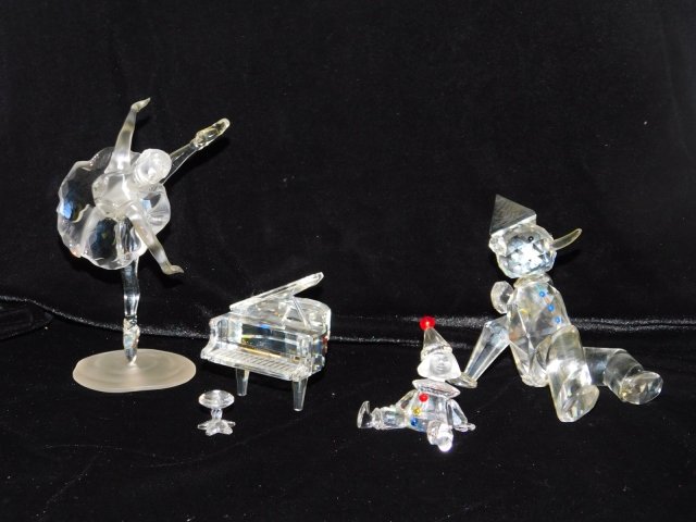 FOUR CRYSTAL FIGURES: SWARVOSKI BALLERINA, PIANO, CLOWN, AND PINOCCHIO.