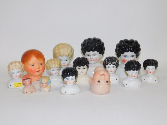 COLLECTION OF PORCELAIN DOLL HEADS: LARGE COLLECTION. LARGEST IS 5". SMALLEST IS 1 1/2"