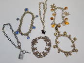 SIX COSTUME BRACELETS