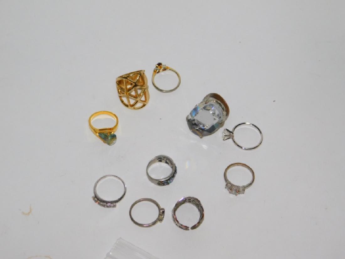 COLLECTION OF COSTUME RINGS: VARIOUS SIZES AND STYLES.