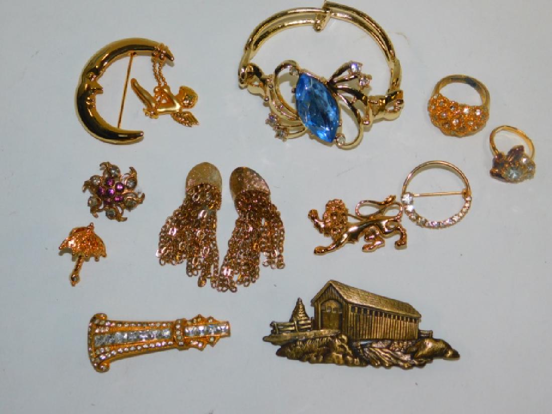COLLECTION OF COSTUME JEWELRY: RINGS, BRACELET, AND PINS