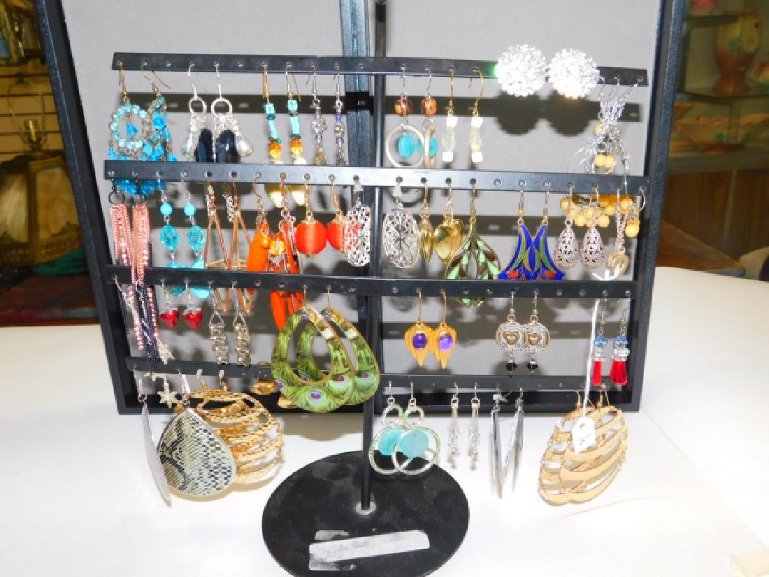 LARGE COLLECTION OF COSTUME EARRINGS.: STAND INCLUDED. GORGEOUS VARIETY OF PIERCED EAR EARRINGS WITH A FEW CLIP ON EARRINGS. SOMETHING FOR EVERY EVENT AND OUTFIT!