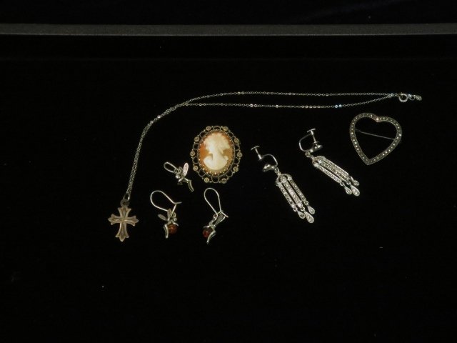 6 Pieces Sterling Jewelry: 1 marcasite heart pin, 1 cameo pin, 1 pr. Pierced fairy earrings, 1 fairy pendant, cross on 16" chain, 1 pr. Marcasite clip earrings