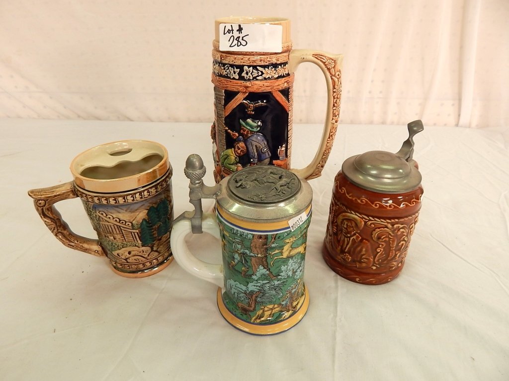collection of beer steins: comprised of one large beer stein along with 3 small beer steins