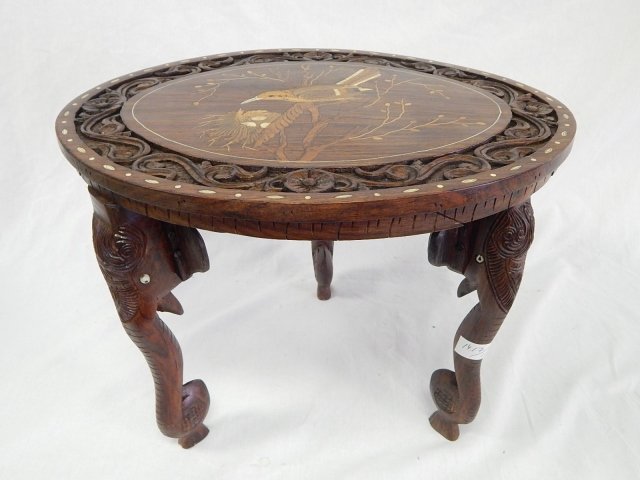 SMALL CARVED INLAID TEAK 3 LEGGED TABLE AS IS: AS IS!14 1/2 TALL, 18 DEEP. ELEPHANTS AND NESTING BIRDS. CRACK ON LOWER TOP EDGE.
