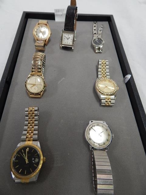 LOT OF SEVEN MENS WRIST WATCHES: TIMEX, GENEVA, QUEST, MEDCO, CARTIER (POSSIBLE REPRODUCTION), LORD ELGIN, GUCCI (POSSIBLE REPRODUCTION). CONDITION AS IS.