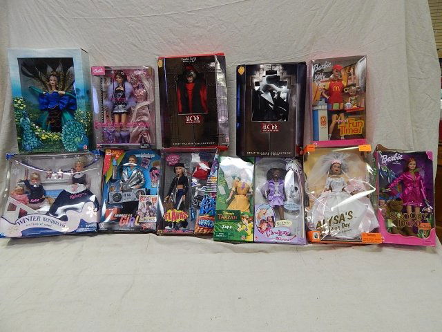 12 BARBIES AND OTHER ASSORTED DOLLS: PEACOCK BARBIE, WINTER WONDERLAND BARBIE, CRUELLA DE VIL BARBIE, TARZAN BARBIE, MCDONALDS BARBIE AND MORE!