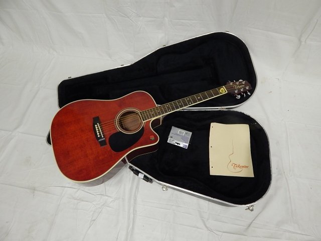 TAKAMINE GUITAR: MINOR SCRATCHS, PLAYS WELL, WITH CASE AND BOOK.