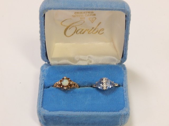 TWO 10K GOLD RINGS: ONE IS AN OPAL, AND ONE IS AN AQUAMARINE.