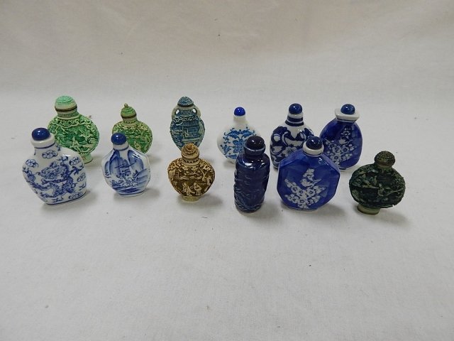 COLLECTION OF ASSORTED SNUFF BOTTLES: MADE OF COMPOSITION AND CERAMIC MATERIALS. TALLEST IS 3".