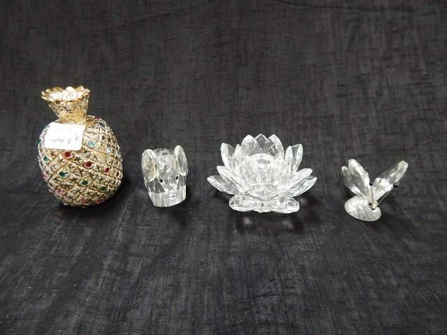 FOUR PIECES SWAROVSKI: TALLEST IS 4". ELEPHANT, CANDLE HOLDER, BUTTERFLY, PORCELAIN PINEAPPLE VASE.