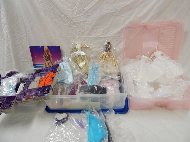 LARGE ASSORTMENT OF DESIGNER CLOTHES: FIT 12" FASHION DOLLS (BARBIE AND OTHERS). SEVERAL WEDDING GOWNS.