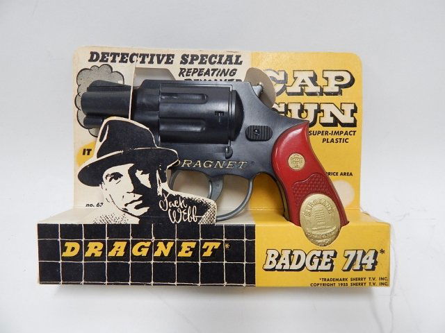 TOY DRAGNET DETECTIVE REPEATING REVOLVER CAP GUN: IN ORIGINAL PACKAGE. CONDITION AS SHOWN. #1.