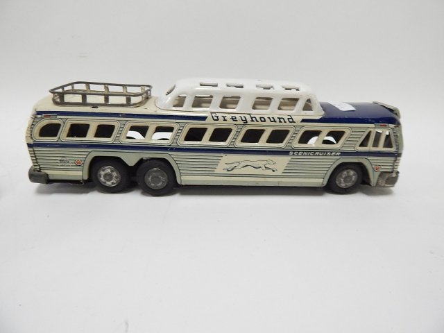 TWO GREYHOUND BUSES, ONE MISSING WHEELS.: CONDITION AS SHOWN.