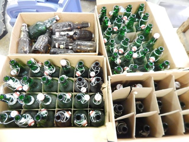 FOUR BOXES OF EUROPEAN BEER BOTTLES: CONDITION AS SHOWN.
