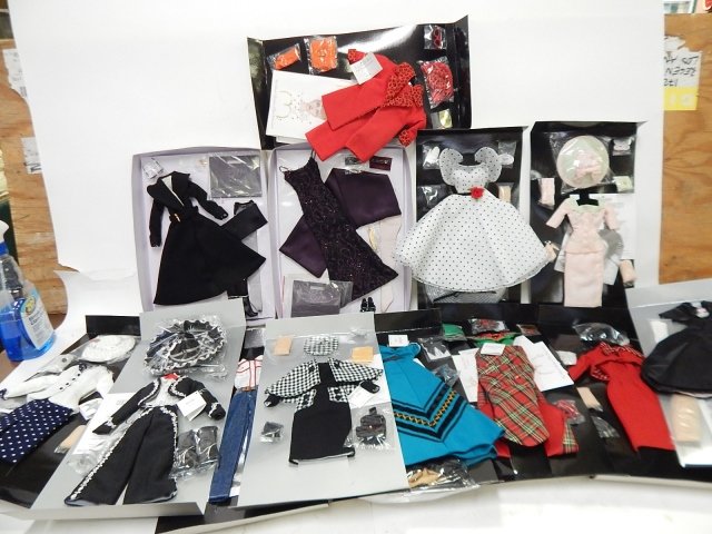 LOT OF DOLLS CLOTHES 13 COSTUMES: IN ORIGINAL PACKAGES. MADRA CREATED FOR THE GENE MARSHALL COLLECTION