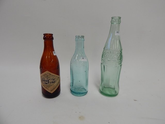 3 COKE BOTTLES: 3 VINTAGE COKE BOTTLES, ONE WITH PAPER LABEL