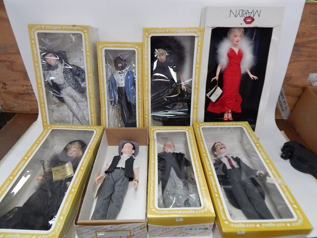 EFFANBEE DOLLS PLUS MARILYN MONROE DOLL: IN ORIGINAL BOXES. SEVEN EFFANBEE DOLLS: GROUCHO MARX, W.C. FIELDS, ART CARNEY, MAE WEST (2), LIBERACE, LOUIS ARMSTRONG. MARILYN MONROE BY WORLD DOLL. BOXES A LITTLE ROUGH.