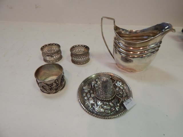 LOT OF STERLING SILVER: 3 NAPKIN RINGS, CREAMER, SOMBRERO.