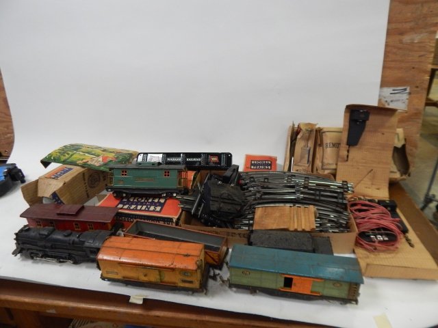 LIONEL TRAIN SET: ENGINE, CARS, TRACK, SWITCH AND OTHER ACCESSORIES.
