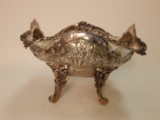 STERLING SILVER CENTER BOWL: 7" TALL X 10" WIDE. MEDIOCRIA FIRMA WITH WILD BOAR MARK. MEDIOCRIA FIRMA MEANS THE MIDDLE WAY. THE WAY OF HARMONY PEACE AND BROTHERHOOD. THIS WAS THE FRANCIS BACON FAMILY MOTTO WITH THE BOAR AS THE FA