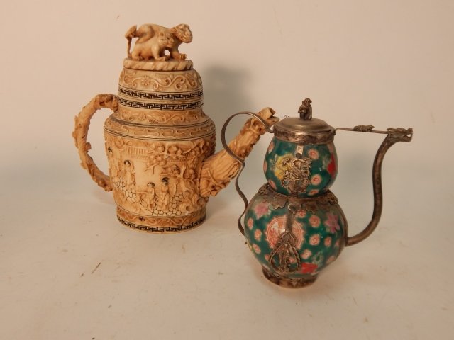 TWO SMALL TEA POTS: 7" TALL OF THE TALLEST. ONE IS COMPOSITION; ONE IS PORCELAIN AND TIN.