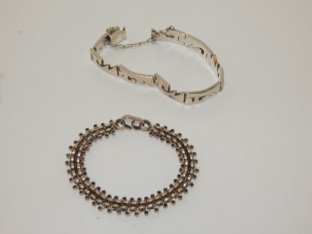 2 STERLING BRACELETS: ONE IS CHAIN AND ONE IS MODERN MOTIF.