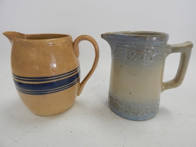 TWO POTTERY PITCHERS: UNMARKED. GOOD CONDITION. 6" TALL.