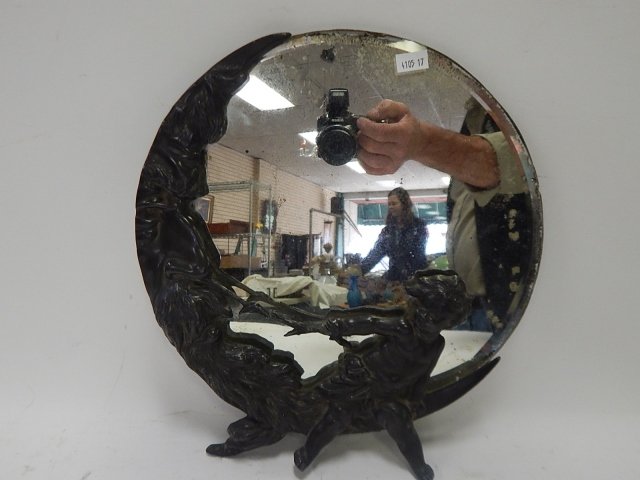 MAN ON THE MOON MIRROR: WITH CHERUB. 13" ROUND. MIRROR IS CHIPPED. SILVERING GONE. PEWTER