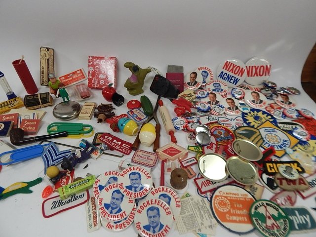LARGE LOT OF TOYS, PATCHES, AND PRESIDENTIAL PINS: NIXON, ROCKEFELLER, AND WALLACE PRESIDENTIAL PINS. TIN CANS, BOTTLE STOPPERS, MATCHES, SMOKING PIPE, WHISTLES, AND SO MUCH MORE