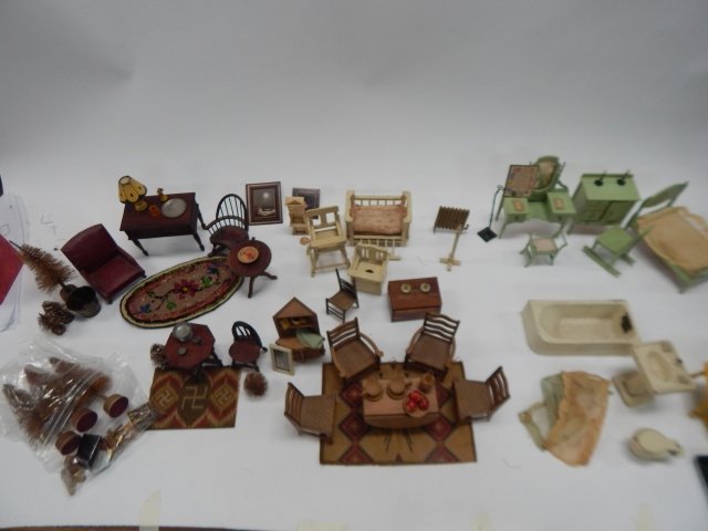 LARGE LOT OF DOLL HOUSE FURNITURE: FURNITURE INCLUDES TABLES, BEDS, CHAIRS, PLATES, DISHES, BABY CRIB, HIGH CHAIR, POTTY TRAINING SET, BED SET, TREES, AND SO MUCH MORE. WELL ENJOYED CONDITION!