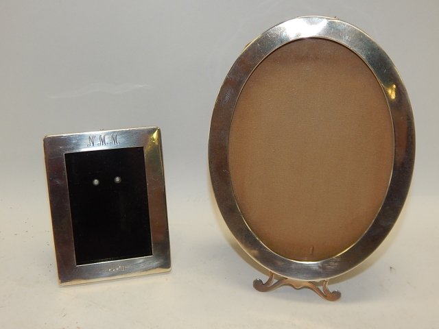 TWO STERLING SILVER PICTURE FRAMES: MARKED STERLING. LARGEST IS 7" TALL, SMALLEST IS 4" TALL. BACK OF LARGE FRAME NEEDING REPAIR
