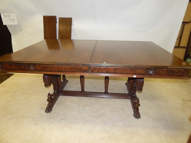 WALNUT DINING ROOM TABLE: TWO LEAVES WITH FOLDING APRINS, MISSING TOE AND PART OF FINIAL ON BASE -VERY LARGE. 72" LONG, 29 AND 1/2" TALL, 45" DEEP.