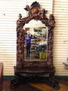 HEAVILY CARVED FIGURAL CONSOLE AND MIRROR