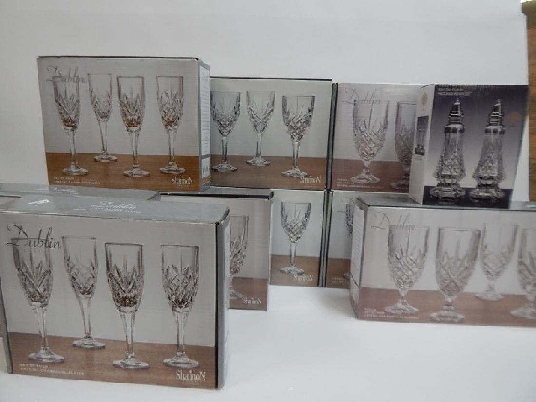 COLLECTION OF SHANNON DUBLIN BEVERAGE GLASSES: 9 SETS GOBLETS, CHAMPAGNE, BEVERAGE, WITH SALT AND PEPPER SHAKES. ALL NEW IN BOX.