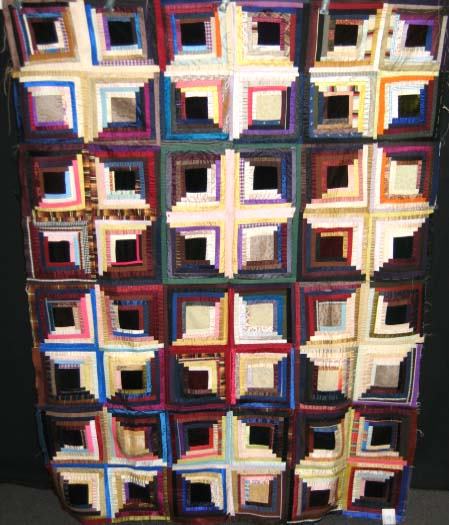 QUILT TOP--LOG CABIN--SUNSHINE AND SHADOWS-1888: LOG CABIN. SILK. SUNSHINE AND SHADOW. 1885. 49.5" X 66.0". PIECED ON FOUNDATION. NO BACKING.