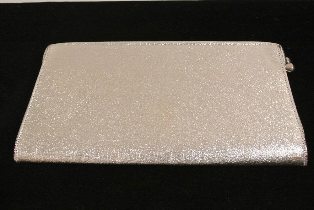 Silver evening clutch: Maker: unknown size:5.5"x11"x1"Strap: none