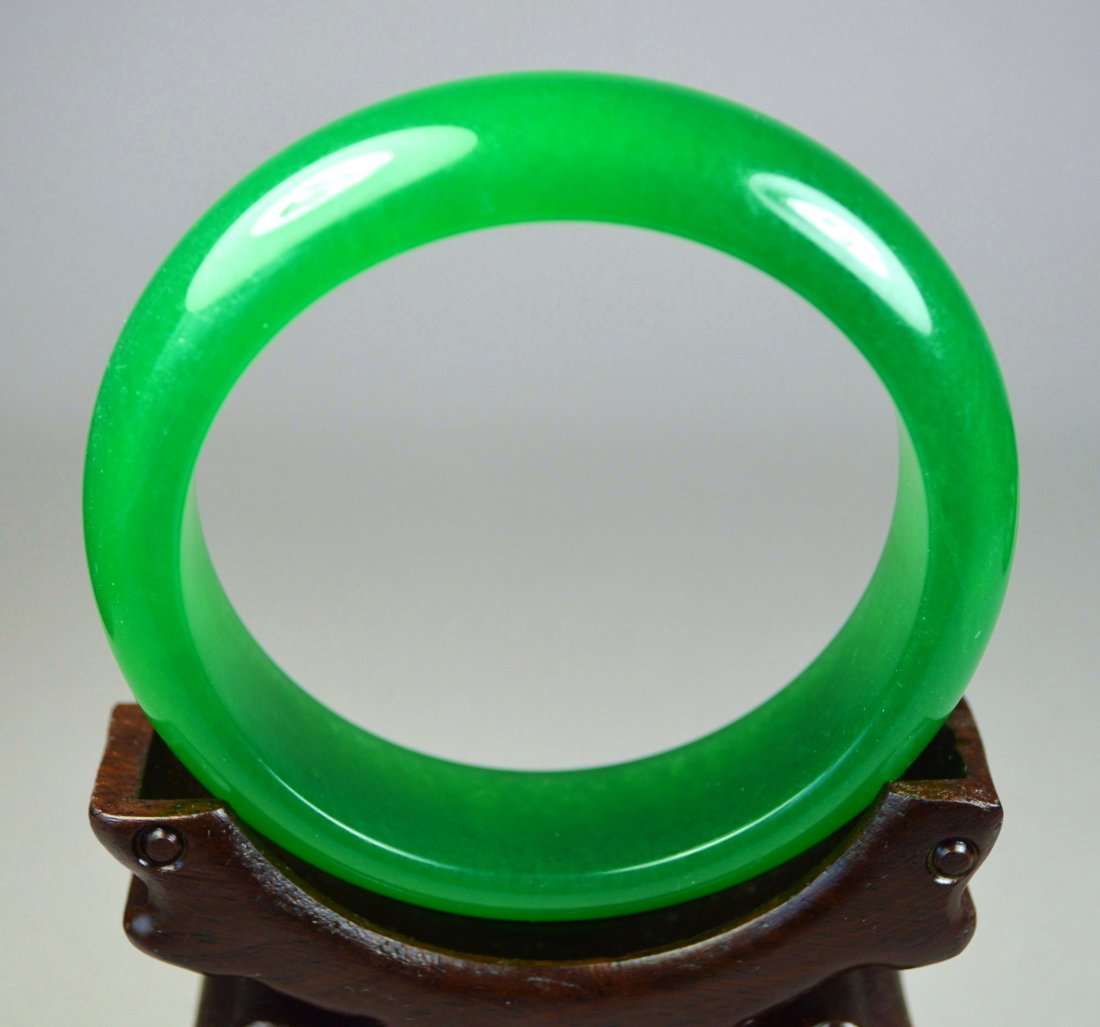 RARE "CHINESE BRIGHT EMERALD GREEN JADE BANGLE: A stunning and rare vintage imperial/emerald green jade bangle, well-polished, excellent color opening: 61 mm and 18 mm width, excellent condition. Provenance: Private collection, Boston.