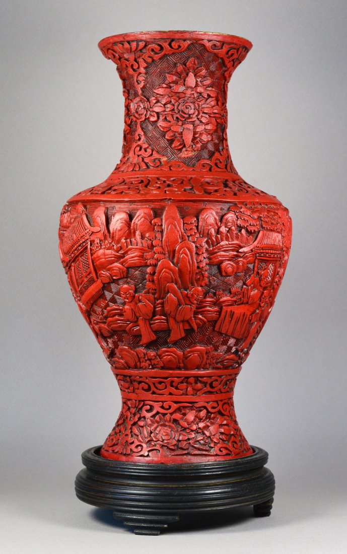 CHINESE QING CINNABAR VASE CA. 19TH C: A stunning Chinese cinnabar vase with landscape design, ca 19th century. It was used as a lamp, hence a small hole at the bottom. A few minor indentations, otherwise in excellent condition. Provenance